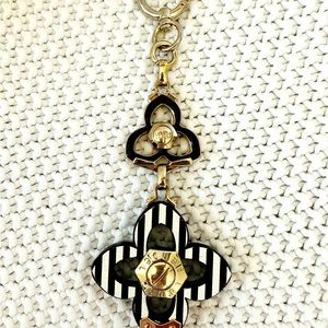 Henri Bendel Charm. Can be attached to purse or a keychain.